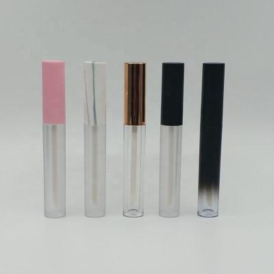 China Cosmetics factory price 4.5ml lip gloss empty plastic round tubes with pink cap black cap for sale