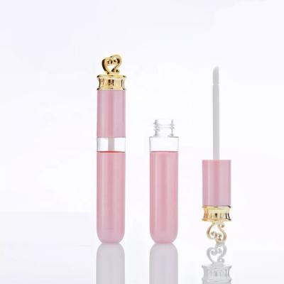 China 7ml empty pink lip gloss tube with heart 7ml empty round pink lip gloss tube packing with gold heart for sale