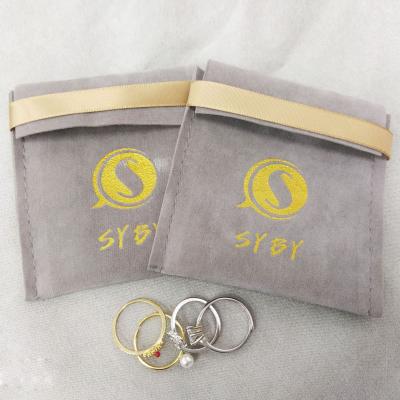 China Custom Printed RuiKaiLi 2020 Hot Sale Gold Logo Mini Envelope Button Closure Luxury Suede Collar Snap Pouch Fresh Flower Packaging Jewelery Bag with F for sale