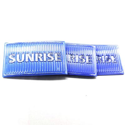 Cina TPU Clothing Brand Tags Blue Stripe Embossed Custom Logo Silicon in vendita