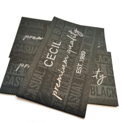 Cina Personalized Luxury Jacron Label Foil Printed Black Custom Garments Labels in vendita