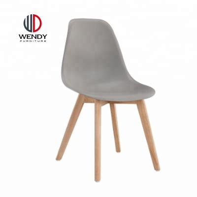 China Modern European Popular Design PP Plastic Chair With Beech Wood Legs for sale