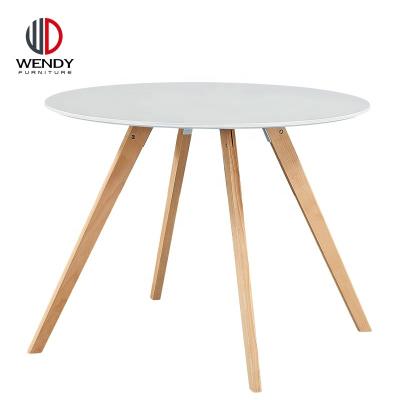 China Traditional Modern Round MDF Top Dining Table With Wooden Legs for sale