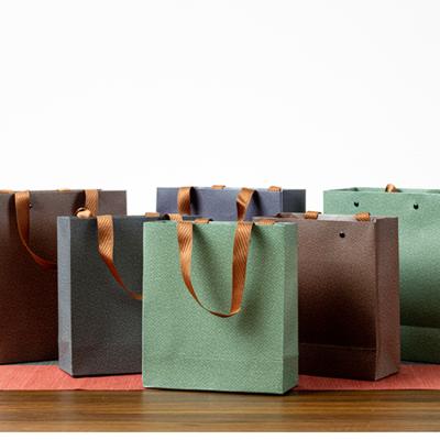 China Wholesales Recycled Packaging Materials TianYi Custom Printed Cheap Recycled Logo Carry Bag Packaging Shopping Paper Bag With Twisted Flat for sale