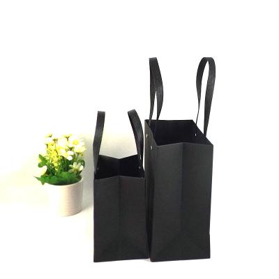 China Recyclable Wholesale Custom Printed Logo Recyclable Black Kraft Gift Craft Shopping Paper Bag With Ribbon Handles for sale