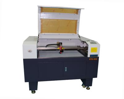 China 80W Motorized Up Down Table Laser Engraving Machine with Rotary Device for sale