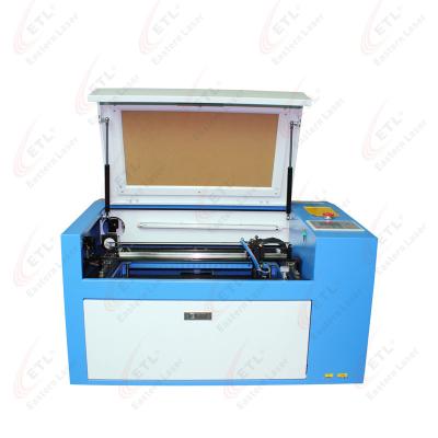 China CNC mini laser cutting machine with rotary device up / down table for nonmetal material for sale