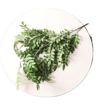 China YIWAN Sophorae Fabric Leaves Long Stem Carob Tree Leaves Wedding Hotel Decoration Artificial Silk Grasshopper Leaves For Home Decor for sale