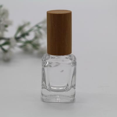 China Personal Care 15ml Empty Wooden Cap Gel Nail Polish Glass Bottle for sale