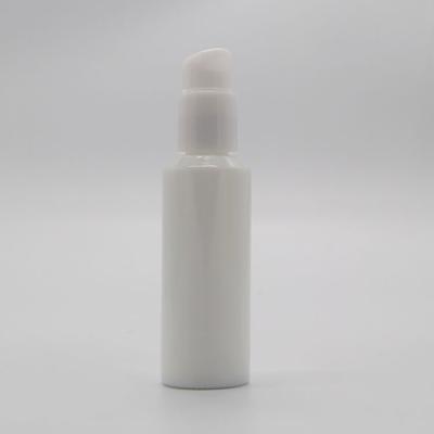 China Personal Care Factory 50ml Round White Porcelain Glass Bottle With Pump for sale