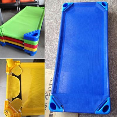 China Preschool cheap Children Plastic Bed with Mesh Cloth Stackable for sale