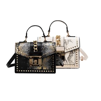 China Metal flower top handle small chain pattern leisure crocodile small handbags designers handbags for ladies for sale