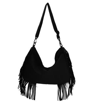 China SP450 Fashion Handbag Durable Canvas Shoulder Bag With Tassel for sale