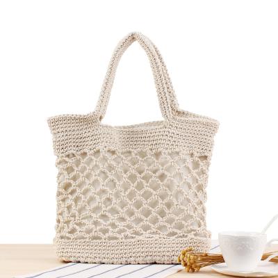 China New Solid Color SP766 Cotton Yarn Durable Hand Crocheted Bag Female Forest Vacation Beach Portable Straw Bag for sale