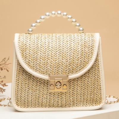 China 2021 Durable Vintage SP781 Straw Handbags Portable Handheld Straw Bag With Chime Handle for sale