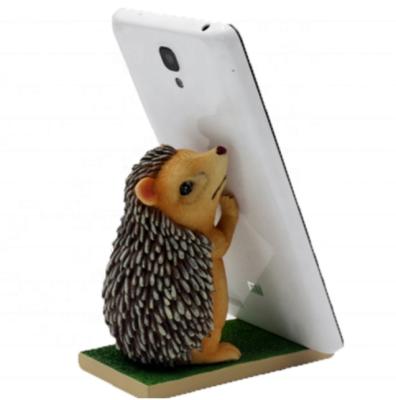 China Global Decoration Handmade Resin Cute Animal Hedgehog Mobile Phone Bracket, iPad Mobile Phone Tablet Bracket for sale