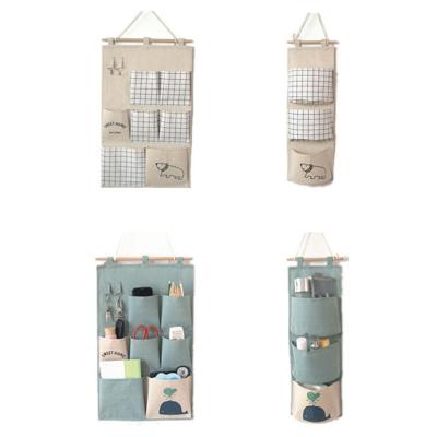 China Hot Selling Low Price Folding Multi Pockets Cartoon Cotton And Canvas Children's Bedside Hanging Storage Bag for sale