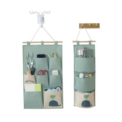 China At present popular cotton folding and wall canvas door hanging storage bag organizer with waterproof PE layer for sale