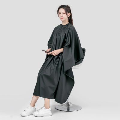 China Convenient custom printing LOGO salon polyester black dress haircut hairdresser cape for sale