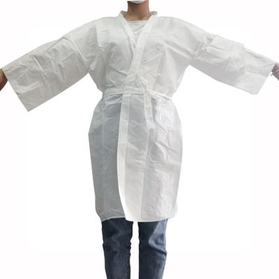 Cina Wholesale QUICK DRY nonwoven over short sleeve disposable nonwoven kimono uniform customized sauna clothes in vendita