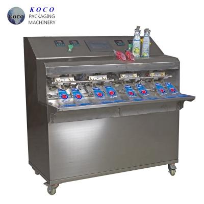 China KOCO 2020 hot selling KY - 8 liquid water, juice, milk filling and sealing machine for sale