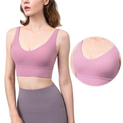 China Fashion women's four way deep v-chest sports bra pink padded sports bra pink yoga wear top custom for sale