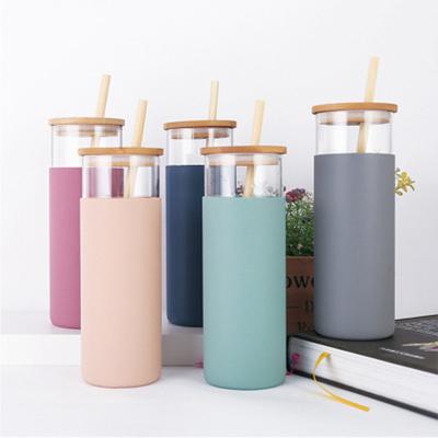 China 450ml Straw Silicone Protective Sleeve Juice Beverage Stocked Glass Water Bottle With Bamboo Lid for sale