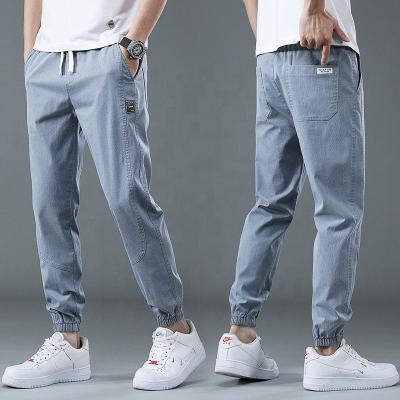 China New Anti-wrinkle slim fit trend casual loose pants tapers waist simple elastic pants stretches fashion skinny jeans for sale