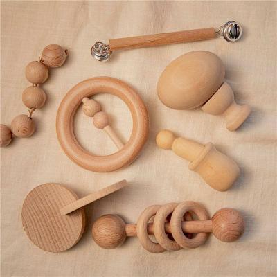 China Wooden Montessori Baby Wooden Teether Toys Hand Bell Baby Rattle Toy Musical Instrument Wooden Toys for sale