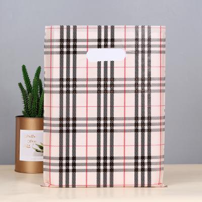 China Safety Plastic Tote Bag Gift Packaging Bag Womens Clothing Store Bags for sale