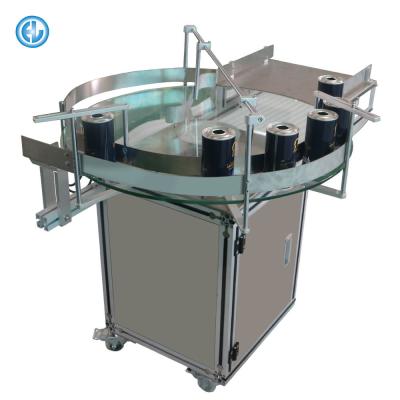 China CLOTHING Factory Bottle Unscrambler Rotary Turntable Table With Labeling Machine for sale