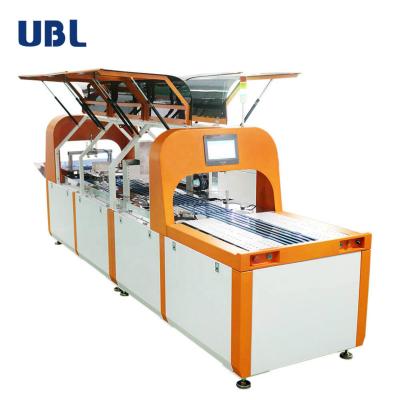 China Automatic Towel Folding and Packing Machine T-shirts Laundry Press Ironing Machine 400cm*96cm*150cm for sale