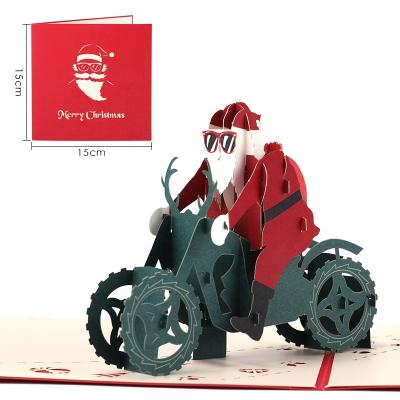 China Europe Amazon Sales Handmade 3d Laser Cut Santa On A Motorcycle Pop Up Christmas Cards for sale