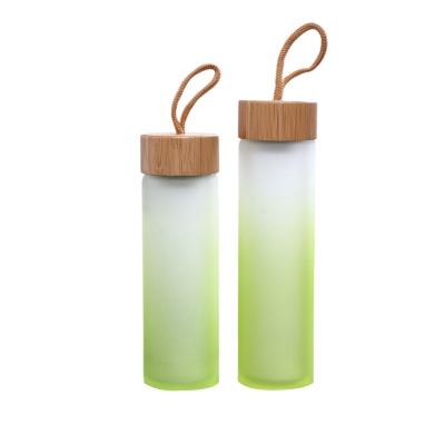 China Frosted Lid Nature Glass Water Bottle High Borosilicate Sustainable Glass Bamboo Water Bottle for sale