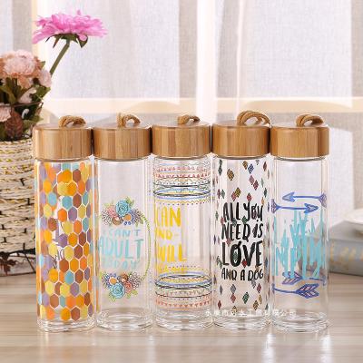 China 500-600ml Custom Eco-Friendly Sustainable Logo High Borosilicate Glass Bamboo Glass Water Bottle With Wooden Lid for sale