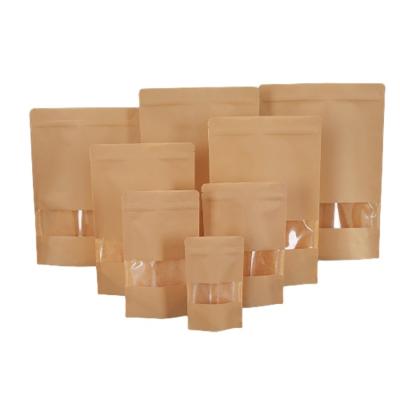 China Recycled Materials Food Grade Tea Leaves Pouch Plain Brown Kraft Paper Stand Up Ziplock Packaging Bag With Window for sale