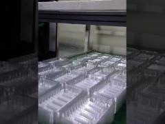 Automated production of transparent meat tray vacuum formed tray