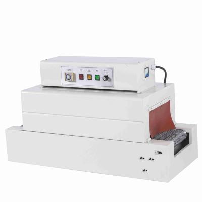 China Hot Selling Hot Air Circulation Food Shrink Wrapping Paper Wrapping Machine Automatic Shrink Machine for sale