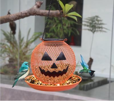 China 2022 New Product Sustainable Halloween Pumpkin Metal Iron Finch Bird Feeders Outdoor Hanging With Solar Light for sale