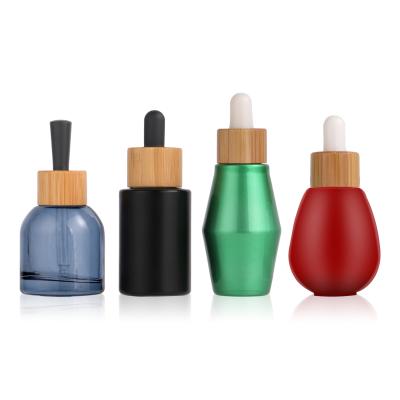 China Cosmetic Wooden Bamboo Dropper Cap Essential Oil Bottle for sale