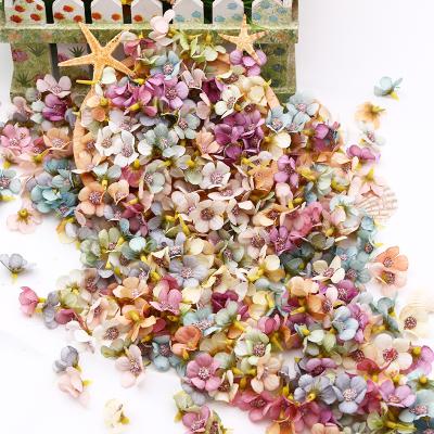 China 100pcs/Bag Multicolor Plastic and Polyester Artificial Flower Daisy Flower Head Mini Silk for Wedding Engagement Party Decor DIY Home Garland for sale