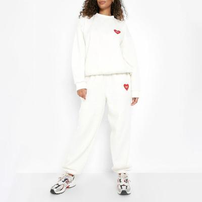 China OEM/ODM Tracksuit Women Sets Hoodie QUICK DRY Customized Tracksuit Embroidered Logo Pocket For Women for sale