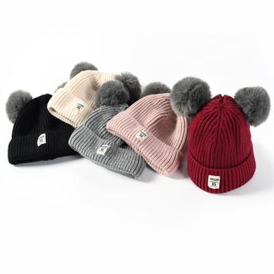 China NEW ARRIVAL Custom Warm Cheap Winter Babies Double Fur Pom Pom Beanie Hat for sale