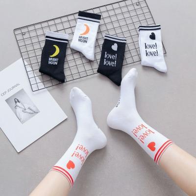 China Japanese style spring and summer mid-tube women's cotton black and white socks love moon Japanese cute women's socks factory direct sales for sale