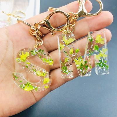 China Decoration.Souvenir.Gifts.Bag FashionKey chain  girly charms glitter Dried Flowers  Resin key chain 26 English Letters Dried Flower Key chain custom for sale