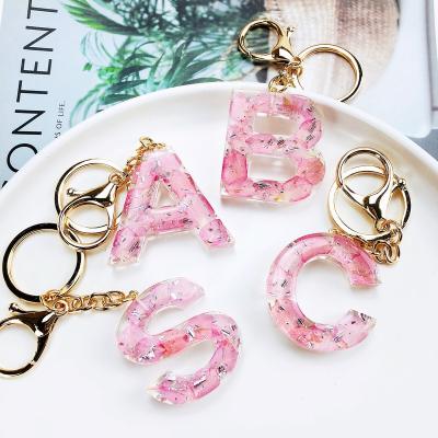 China Promotioanal Gifts New Fashion 26 English Real Flowers  Capital Letter Clear Word charms Promotional Keychains Other Key Chains for sale