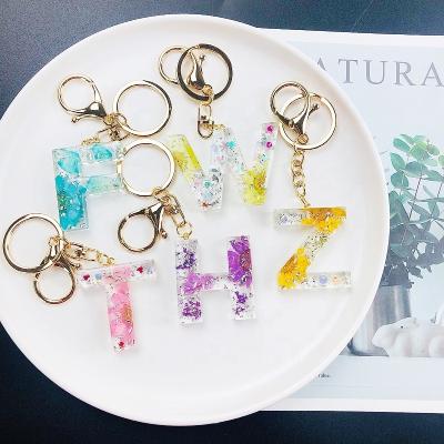 China Metal Fashion new handicraft dried flower Epoxy craft factory wholesale resin dried flower keychain customization for sale