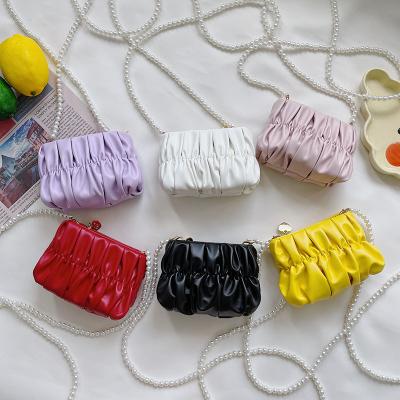 China Waterproof cgirl purple red white yellow black kids designer brand cute mini small small purses and bags cloud purse for kids for sale