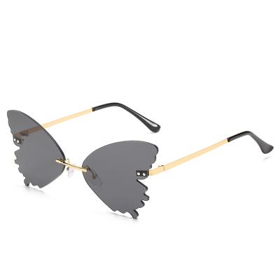 China Brand Designer Luxury Frameless Sun Glass Metal Butterfly Frame Small Light Hot Selling Sunglasses for sale