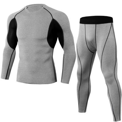 China Adult Muscle Tight Training Suit Breathable Fitness Pants Long Sleeve Sportswear Tracksuits For Men Jogging for sale